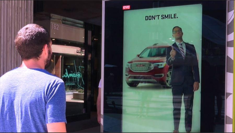 image of dooh advertising board interacting with man using AI facial analytics
